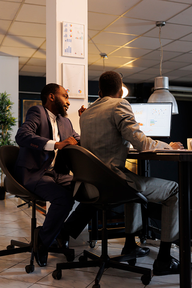 Business professionals discussing Amazon wholesale strategy in an office